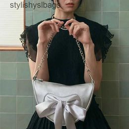 Shoulder Bags Korean version of niche design bow bag for womensspringsummer fashionable wide shoulder strap single shoulderdiagonal cross H240529