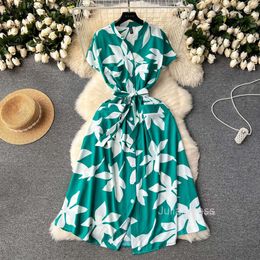 Wind vacation dress for women in 2024 new design with floral binding waist cinching slimming effect mid to long knee length skirt