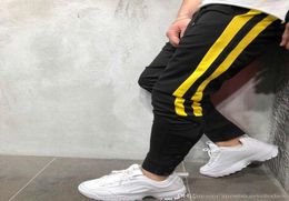 Fashionmens Designer Street Pantalones Hosen gestreiftes Knöpfe Design Bleistift Harem Hosen Casual Sports Joggers4917301