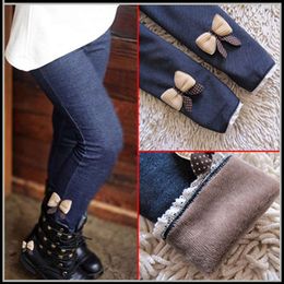 The new spring autumn plus veet thick trousers warm leggings tight pants girl butterfly bald and wild imitation jeans L2405