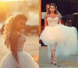 Corset Top Vestres de noiva 2019 Pérolas de miçangas de pérolas lisfícios de tule de verão Vestidos de noiva da praia de praia Saudita Modest3853595