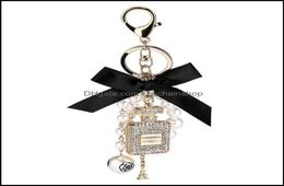 Keychains Fashion Accessories Creative Handmade Diy Diamond Per Bottle Alloy Bow Pearl Luxury Keychain Purses Charm Pendant Ys068 7078707