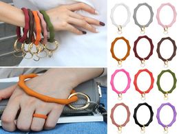 Keychains Big O Silicone Loop Wrist Key Ring Keychain With Gold Clasp Round Strap Accessories Whole Women Bag SuppliesKeychain7402278