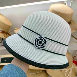 Natural paper grass small fragrant wind Zhushan tea flower decoration summer sun protection sun shading female straw hat small brimmed hat