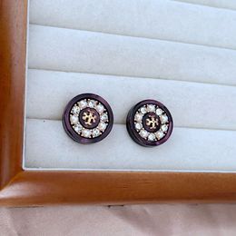 Fashion, luxury and niche design, simple commuting Pearl rhinestones inlaid with round buttons, metal earrings.