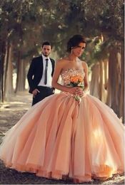 Pink Tulle bollklänning Bröllopsklänningar Stropplösa fantastiska vestidos de novia brudklänningar med strass skräddarsydda arabiska bröllopsklänningar