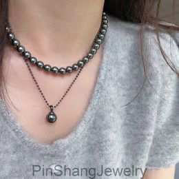 French Shijia Pearl Necklace a luxurious sweater chain with multiple Tahitian black pearls stacked on top