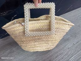 2024 Spring/Summer New Handmade Pearl Beaded Handle Grass Woven Bag Handheld Crossbody Versatile Beach Bag 240402