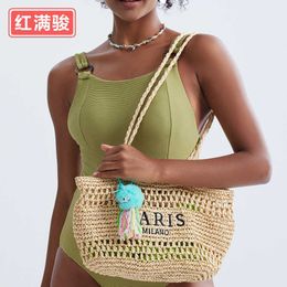 New Handmade Woven Grass Woven Shoulder Bag Letter Hollow Handbag Women's Summer Beach Tote Bag 240402