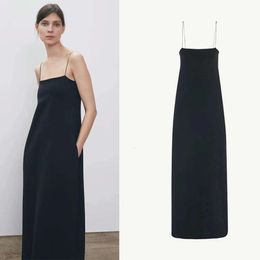 A niche row camisole dress for women with black thin shoulder straps simple and versatile slimming off with a split long skirt for spring and summer
