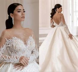 Glitter Beaded Sequin Ball Gown Wedding Dresses Long Sleeves Open Back Dark Ivory Satin Long Bridal Gowns Illusion Crew Neck Sexy Luxury Bride Dress