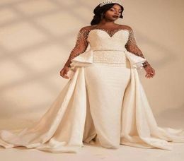 New Amazing Pearls Designer African Wedding Dresses Bridal Gowns Long Illusion Sleeves Beaded Satin A line Court Train Wedding Gow3136613