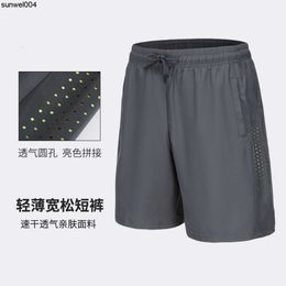 Designer Shorts New Explosions Mens Shorts Summer Quick Drying Breathable Basketball Running Straight Tube Laser Perforated Capris