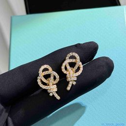 Top Grade Luxury Tifanccy Brand Designer Earring S925 Sterling Silver Knot Hollow Earrings Key Light Luxury Versatile High Quality Designers Jewellery
