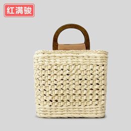 Instagram hollowed out handmade woven bag for women, niche wooden handle grass woven bag, forest style pastoral style shoulder bag 240402