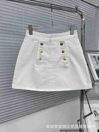 Designer South Oil High end Women's Clothing CE Summer New Korean Edition Double breasted Buckle White High Waist A-line Wrapped Hip Denim Skirt 74S2