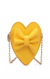 Kids Handbag Newest Korean Fashion Heart Shape Bowknot Crossbody Bags Baby Girls Candies Messenger Bags Coin Purses Teenager Trav8435036