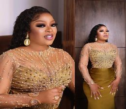 2022 Sexy Arabic Evening Dresses Wear Gold Illusion Jewel Neck Long Sleeves Crystal Beads Mermaid Plus Size Celebrity Dresses Part4067880