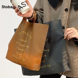 Storage Bags StoBag 50pcs Black Frosted Shopping Bag Tote Matte Plastic Clothes Gift Package Pouch Handbag Portable Custom Logo(Extra Fee)