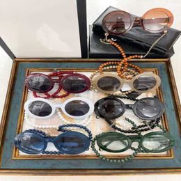 High quality fashionable sunglasses 10% OFF Luxury Designer New Men's and Women's Sunglasses 20% Off Pearl Chain Glasses Pendant Round Net Red Same Style 5489