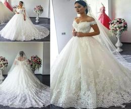 Cheap Modest Arabia Cap Sleeves Ball Gown Wedding Dresses Off Shoulder Dubai Lace Appliques Plus Size Court Train Formal Bridal Go3767746