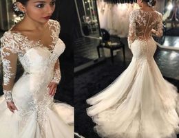 2021 Gorgeous Lace Mermaid Wedding Dresses Sheer Neck Dubai African Arabic Style Long Sleeves Fishtail Bridal Gown Plus Size Illus3218370