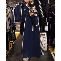 Two Piece Set of Hoodie Jacket and Skirt for Autumn 2023, New Fashionable Casual Sports Set for Women in Large Size