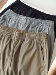 Markenmänner Nylon geschlossene Hose Schnell trocknende Sporthosen Elastizitätsgürtel Kordelzug Casual Hosen Frühling und Herbst Herrenbekleidung