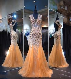 Shinning Heavy Beading Prom Dresses Sexy Open Back V Neck Crystals Beaded Tulle Mermaid Evening Gowns Champagne Floor Length Forma9305597
