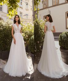 2020 Bohemian ALine Wedding Dresses V Neck Capped Sleeves Lace Appliques Bridal Gowns Button Back Sweep Train Garden Wedding Dres5795146