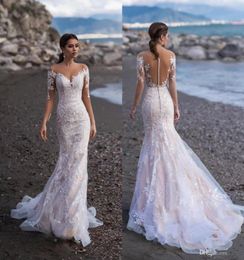 2020 Sheer Long Sleeve Lace Mermaid Beach Wedding Dresses Appliques Tulle Edge Long Bridal Gown With Buttons Custom Made9790169
