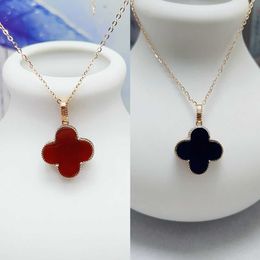 Vans Wearing 18K natural red agate clover pendant on both sides black agate necklace with gold inlaid cross as a niche gift