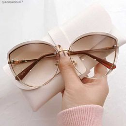 Sunglasses High quality womens oval rimless sunglasses Womens hot metal eye shadow Womens driving glasses Ms. Sonnenbrille ZonnebrilL2404
