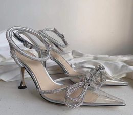 Bow Rhinestone abbellito in PVC chiaro PVC 95 cm tacchi a spillo sandali Pompe trasfaristiche scarpe bobine donne lussuose designer di design abbigliamento 7889571