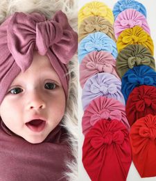 INS NEW 14 Colors Fashion Pure Color Baby Beanie Cap Bow Knot Hair accessories Cap Infant Turban Hats2139844