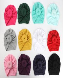 Fashion Cute Infant Baby Kids Toddler Children Unisex Ball Knot Indian Turban Colourful Spring Cute Baby Donut Hat Solid Colour Cott1683984