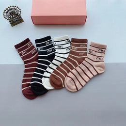 New socks designers for men and women sell Joker classic high-quality breathable cotton ankle socks with black background and white background.