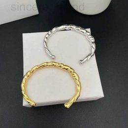 Bangle designer Luo family. Simple Twisted Pattern Bracelet, Light Luxury, High Grade, Elegant and Personalised Bracelet Handpiece 2DI5