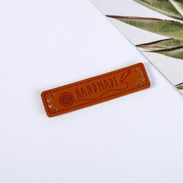 50pcs handmade leather labels/handwork tags/Manual Patchwork Labels PU Tags DIY Sewing label cloth Garment Labels/in stock