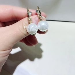 Fashion curved hook pearl alloy silver needle earrings ear studs popular ear pendants accessories for women favorite gifts in European and American countries