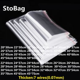 StoBag 100pcs Thick 7 Wires Clear Self Adhesive Plastic Bags Clothing Jewellery Candy Gift Packing T-Shirt OPP Bag Wedding Party