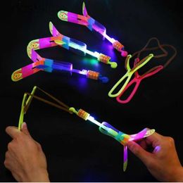 LED Flying Toys Outdoor Shining Rocket Flash LED Light Slingshot Elastic Helicopter Rotating Outdoor Flying Toy Arrow Party Gift Childrens Favour 240410