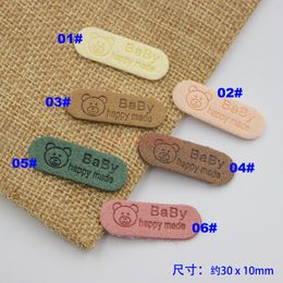 50pcs Soft Suede Embossed Hand Made Tags Baby Bear Label Tags Sewing Garment Tags for Baby Hats Gloves Socks Embellishment