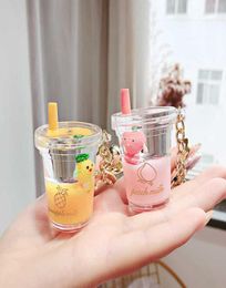 Floating Creative Cute Key Chain Quicksand Keychain Party Favour Liquid Bottle Fruit Keyring Backpack Pendant Keyfob For Women K1032092269