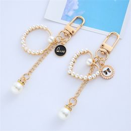 Exquisite Tassels Heart Pearl Keychain Love Bowknot Metal Tag Keyrings Headset Charms Accessories Bag Pendant Car Key Holder