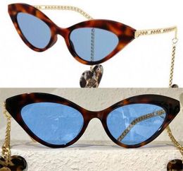 Womens sunglasses G0978S fashion classic heartshaped pendant metal temples cateye earrings sun glasses with zebra pattern frame 5301718