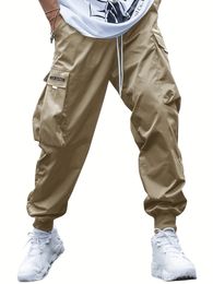 Multiple Pockets Men Loose Work Pants Vintage Solid Patched Flap Pocket Drawstring Waist Cargo Casual Street Jogger Pants for Outdoor Wear Please Purchase A Size Up