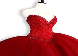 2018 New Red Quinceanera Dresses Ball Gown Crystals Pearls Ruffles Tulle Lace Up Back Pageant Gowns For Girls Q467681414