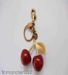 Keychain in stile ciliegia color rosso chapstick wrap rossetty cover team lipbalm cozybag parti modalità moda9126782 wjeo
