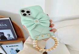 Luxurys Desingers iphone Cases Fashion 13 Mobile Phone Case 12117 with Bow Stereo Camera portemonnaie 12pro Fashion and Generou6266036